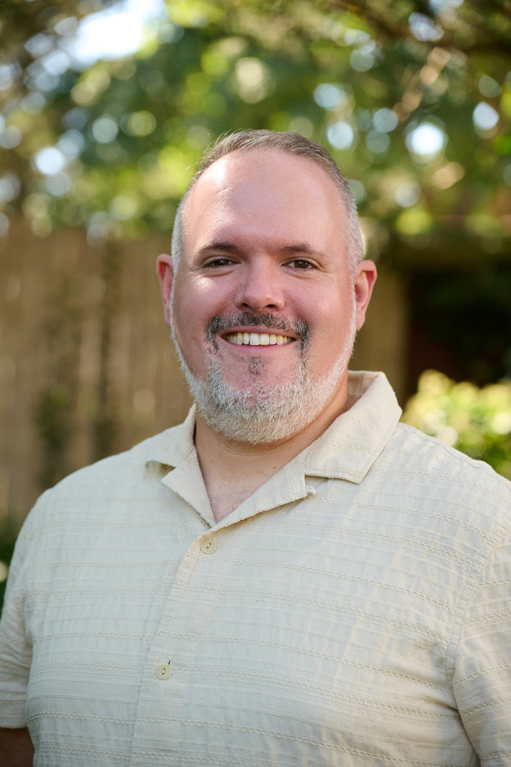 Zachary Cohn smiling outdoors